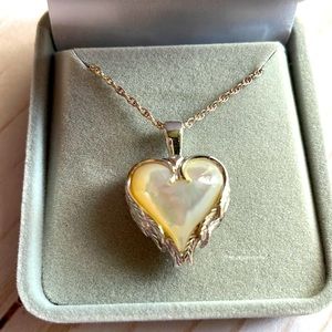 New never filled or worn Angel wings with mother of pear ash cremation necklace